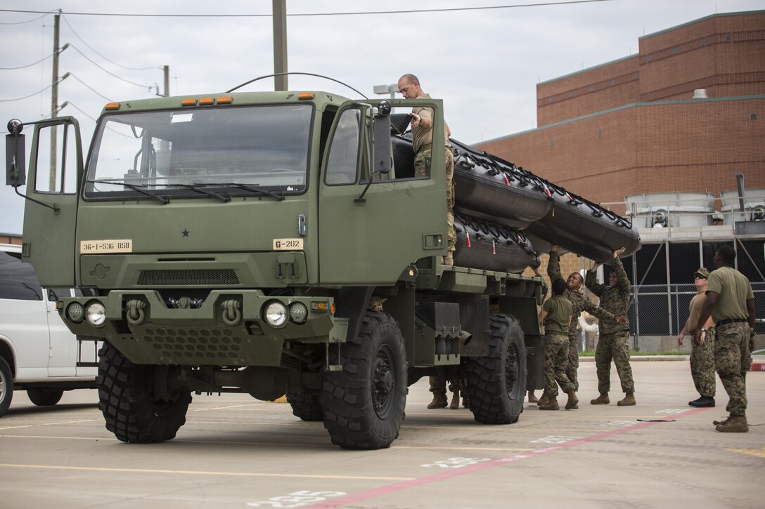 KATY, Texas – Marines with Charlie Company, 4th Reconnaissance Battalion, 4th Marine Division, Marine Forces Reserve, load U.S. Marine Corps F470 Zodiacs Combat Rubber Raiding crafts on to a U.S. Army 1078 A1 Truck at Katy High School in Katy, Texas, Aug. 30, 2017. Marines from Charlie Company supported rescue mission in the wake of Hurricane Harvey, which flooded much of the surrounding region displacing 30,000 people, and flooding thousands of homes. (U.S. Marine Corps photo by Lance Cpl. Niles Lee/Released)