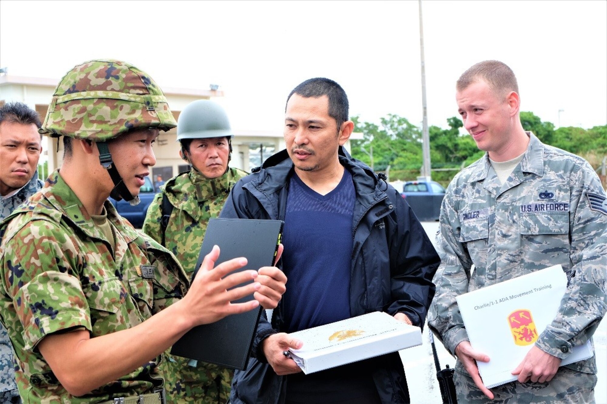 Takahiro Namizato, a load planner assigned to the 733rd Air Mobility Squadron, works with the Japanese Ground Self Defense Force and the Japanese Air Self Defense Force during a joint, bi-lateral air load exercise with the 1st Battallion, 1st Air Defense Artillery Regiment from May 17-18, 2017. Namizato was awarded the Army Achievement Medal for his contributions to the exercise during a ceremony at Kadena Air Base, Japan, Aug. 23, 2017. (U.S. Air Force photo by Tech. Sgt. Jamie Powell)
