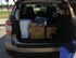 Auburn Rush, spouse of Tech. Sgt. Ryan Rush, 22nd Maintenance Group quality assurance inspector, transfers donations for Hurricane Harvey victims to her car, Aug. 30, 2017, at McConnell Air Force Base, Kan. Ryan and other Airmen are heading to Dickinson, Texas to help with flood relief for the residents in his father’s neighborhood. (U.S. Air Force photo/Staff Sgt. Rachel Waller)