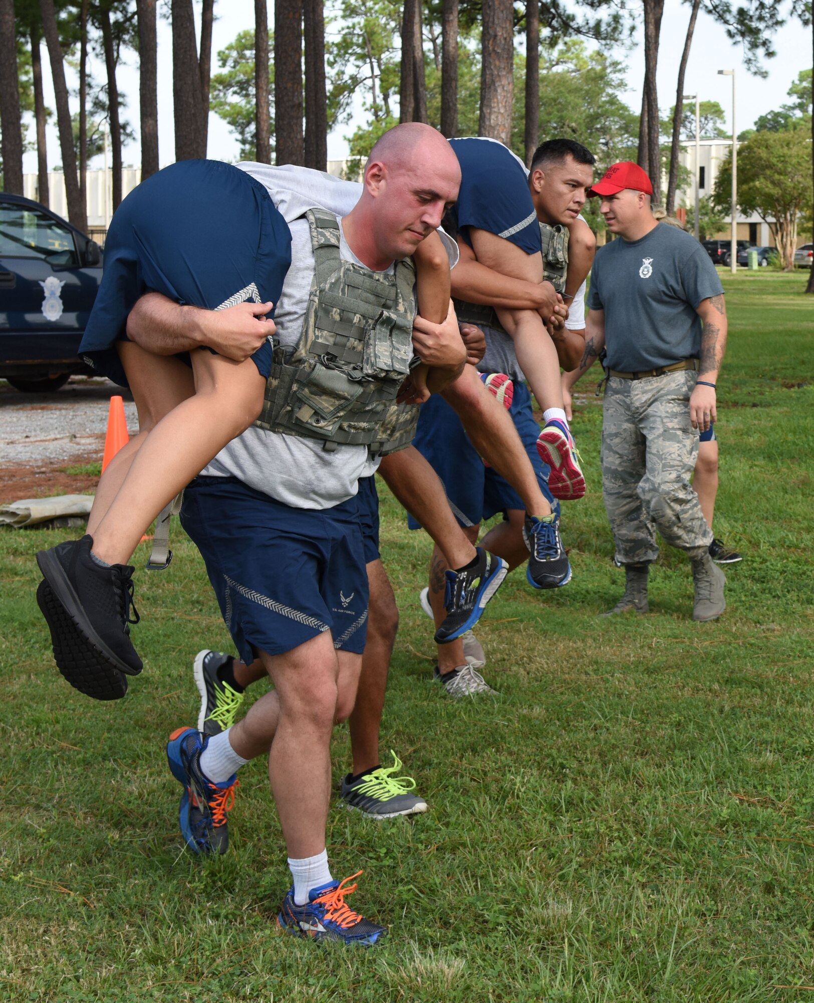 Team Five members carry their team to the next challenge during the Senior Noncommissioned Officer Professional Enhancement Seminar Warrior Challenge Aug. 25, 2017, on Keesler Air Force Base, Mississippi. Keesler’s newest SNCOs also participated in physical strength activities as well as answering trivia questions about Keesler AFB and enlisted history. (U.S. Air Force photo by Kemberly Groue)