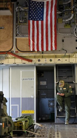 Capt. Adam Kouroupas, 16th Airlift Squadron pilot, reviews a preflight checklist during a humanitarian assistance and disaster relief mission at Pope Army Air Field, N.C., Aug. 30, 2017. Kouroupas, who lived in Galveston, Texas for four years, helped his home state by flying supplies from Pope. “We are all Texans today,” said Kouroupas of the effort given by service members during the flight.