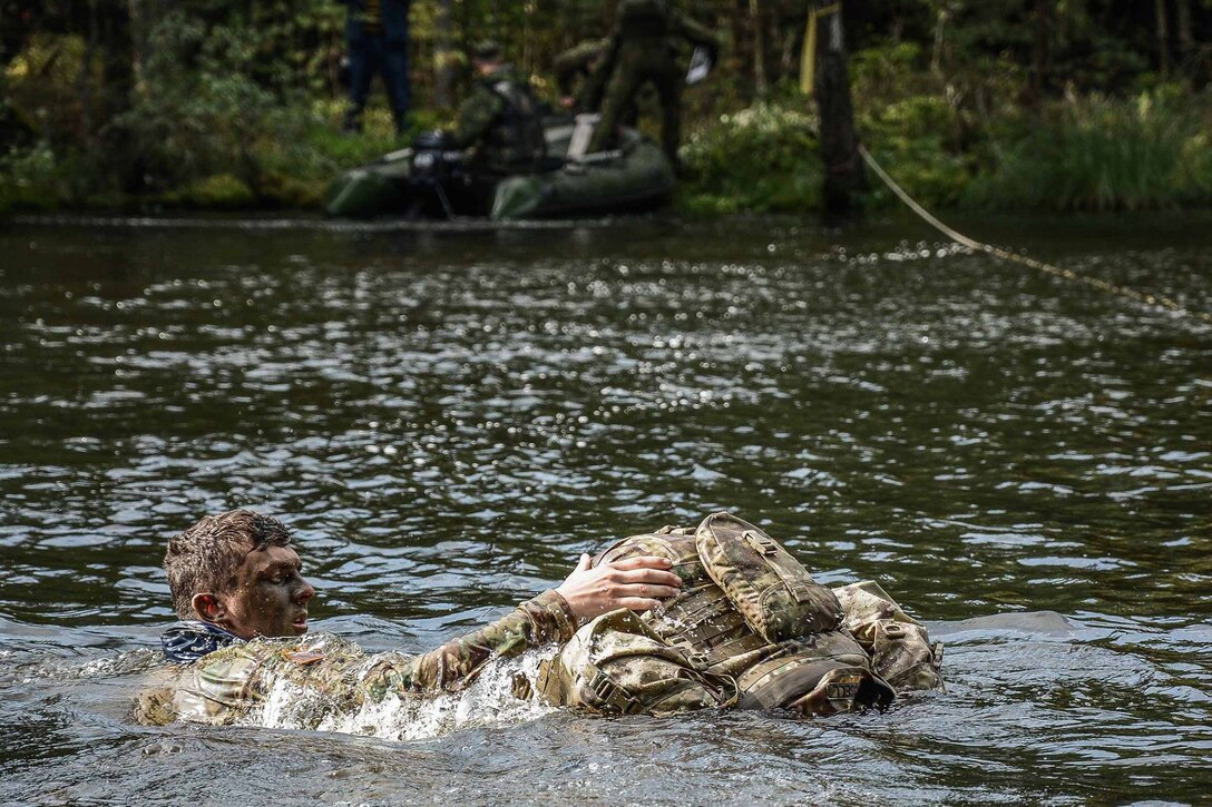 A U.S. soldier competes in the Lithuanian Best Infantry Squad Competition at Rukla Training Area, Lithuania