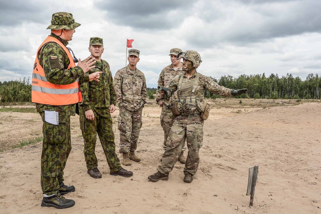 U.S. soldiers receive feedback during the Lithuanian Best Infantry Squad Competition at Rukla Training Area, Lithuania