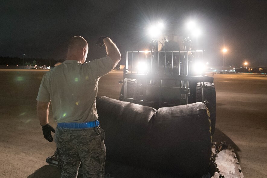 Airmen from the Kentucky Air National Guard’s 123rd Contingency Response Group, augmented by Airmen from the Mississippi ANG, establish an air cargo and aeromedical evacuation hub at George Bush Intercontinental Airport in Houston, Aug. 30, 2017, in support of Hurricane Harvey relief efforts. The Airmen will transfer patients from ambulances and prepare them for air movement so they can be flown by military aircraft to appropriate health care facilities. (U.S. Air National Guard photo/Staff Sgt. Joshua Horton)