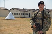 Airman 1st Class Dillan Caceres, 341st Missile Security Forces Squadron response force leader, stands in front of a missile alert facility Aug. 28, 2017, near Belt, Mont.