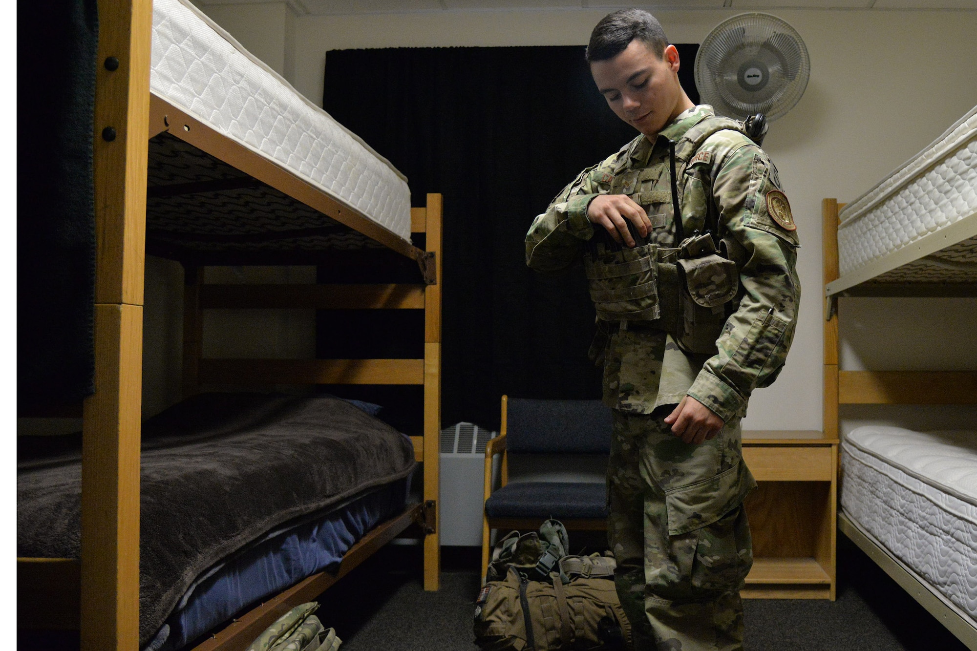 Airman 1st Class Dillan Caceres, 341st Missile Security Forces Squadron response force leader, dons his gear at a missile alert facility Aug. 28, 2017, near Belt, Mont.