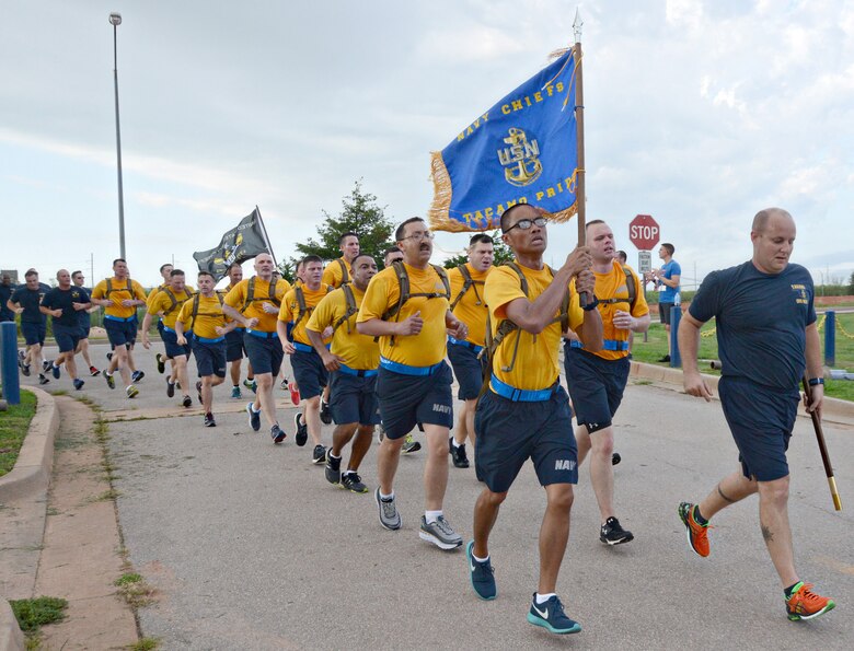 Chiefs and chief selects run in formation around the TACAMO complex during the Howie Shapiro 5K run Aug. 18 at Herc Park.