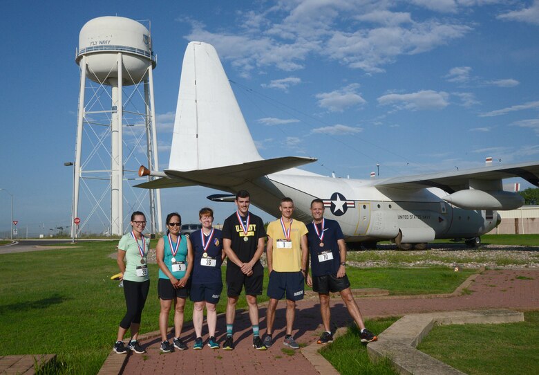 Top three men's and women's finalists in the annual Howie Shapiro 5K Aug. 18 at the TACAMO complex were YN2 Brianna Bays, VQ-3, third place women's; Anhthu Vo, 557th Software Maintenance Squadron, second place women's; AWV1 Nancy Nichols, VQ-7, first place women's; AE3 Keagan Adams, VQ-4, first place men's; IT2 Dustin Schmidt, SCW-1, second place men's; and Capt. Mike Black, deputy wing commander for SCW-1, third place men's. Howie Shapiro was one of the most influential people in TACAMO ("Take Charge and Move Out") history, being instrumental in bringing the Wing to Tinker and helping them acquire more aircraft.