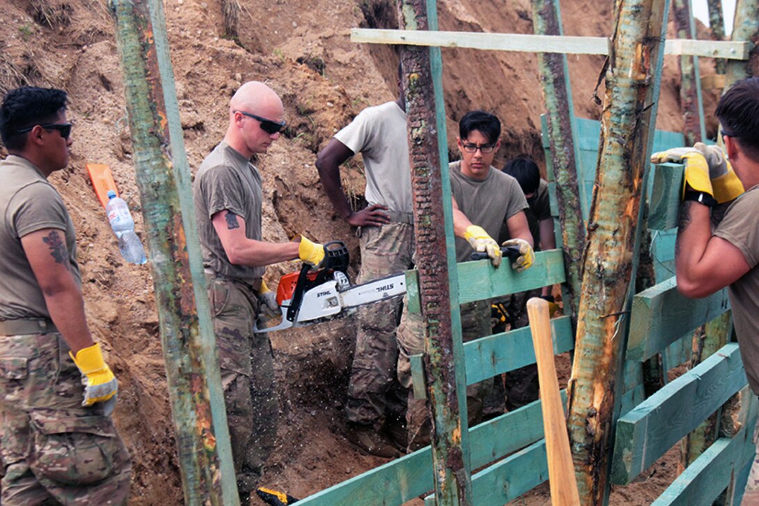 Soldiers build a trench in Poland.