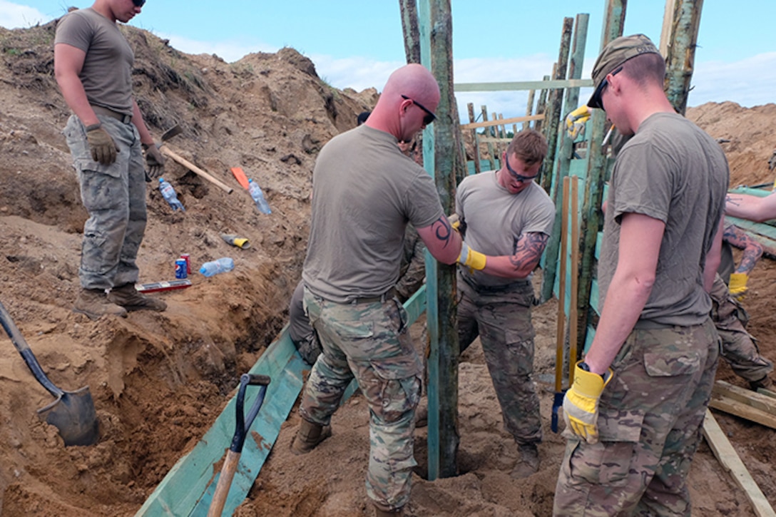 Soldiers build a trench in Poland.