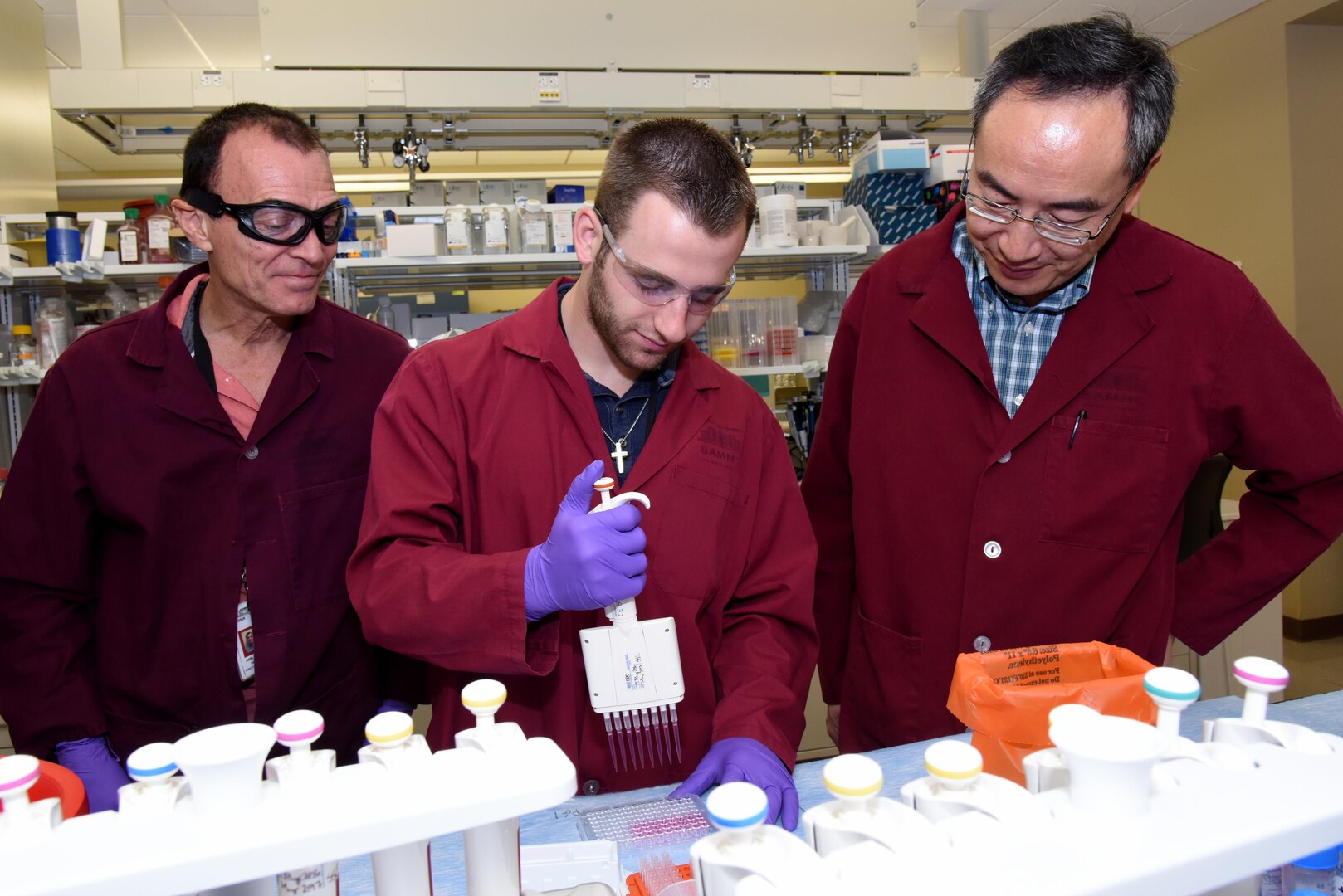University of Pennsylvania student, Ryan Leone (center) and his summer mentors, Drs. Daniel Darlington and Xiaowu Wu, Ph.D., at the U.S. Army Institute of Surgical Research at Joint Base San Antonio-Fort Sam Houston.