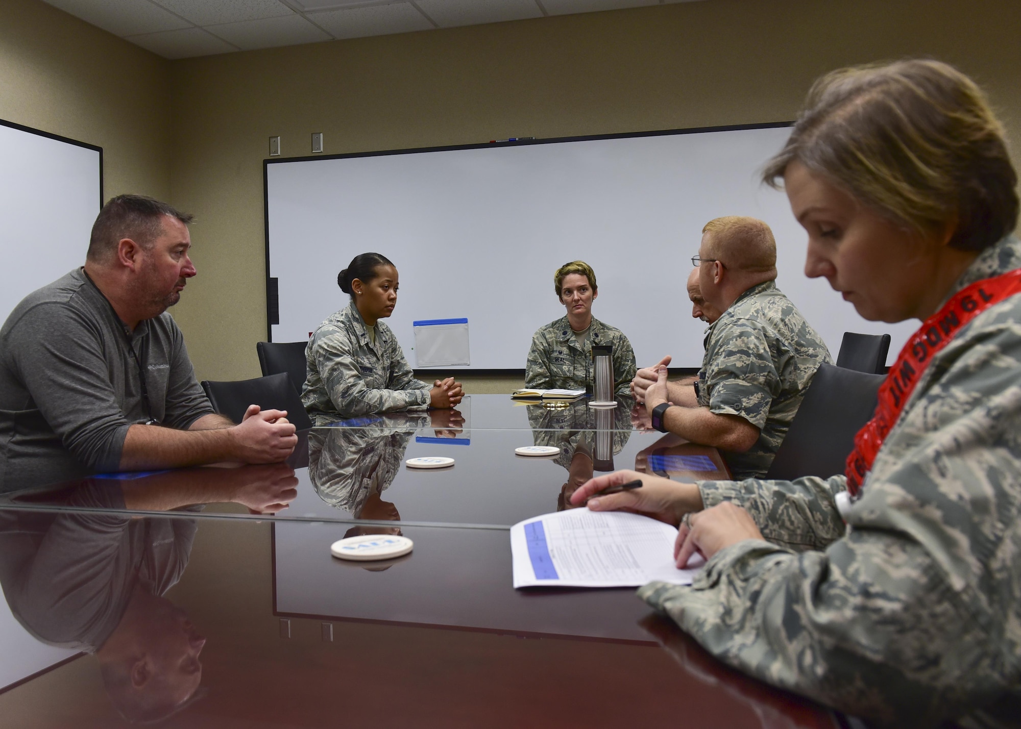 Lt. Col. Elizabeth Beal, 19th Medical Operations Squadron commander, is briefed on the situation of a medical group exercise August 24, 2017 at Little Rock Air Force Base, Ark. The exercise had an emphasis on readiness. (U.S. Air Force photo by Airman Rhett Isbell)
