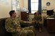 Capt. Mara Title, 90th Security Forces Group chaplain, speaks to Senior Airman Ethan Edwards, 90th SFG commander’s executive assistant, in her office at F.E. Warren Air Force Base, Wyo., Aug. 30, 2017. Title has been the 90th SFG chaplain for five months. (U.S. Air Force photo by Airman 1st Class Breanna Carter)