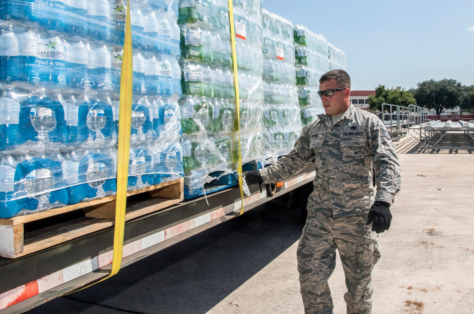 Staff Sgt. James Brush, 502nd Logistics Readiness Squadron, prepares for transport over 30,000 water bottles Aug. 30, 2017 at Joint Base San Antonio-Lackland, Texas.