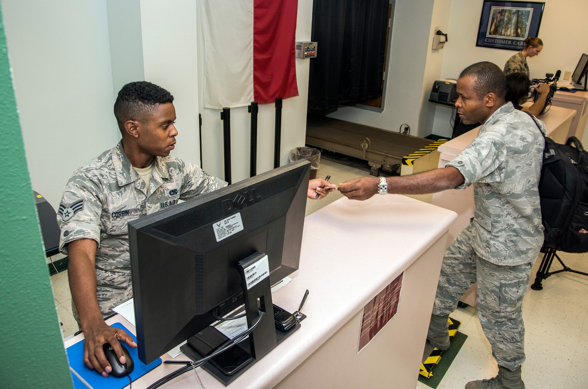 Senior Airmen Dominick Corbin, 502nd Logistics Readiness Squadron, processes Air Force medical personnel from Joint Base San Antonio-Lackland, Texas.