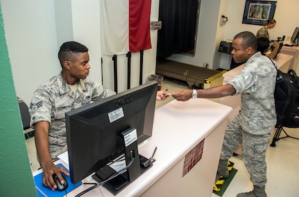 Senior Airmen Dominick Corbin, 502nd Logistics Readiness Squadron, processes Air Force medical personnel from Joint Base San Antonio-Lackland, Texas.