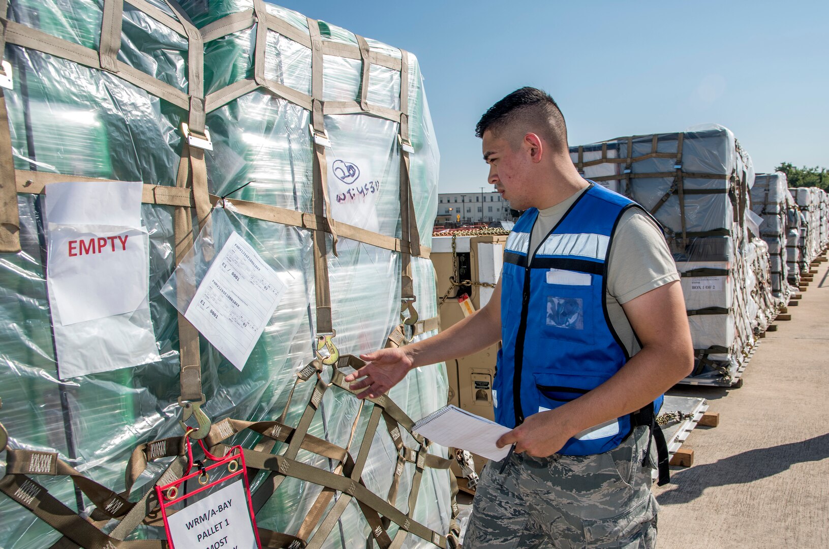 Senior Airman Jorge Gonzalez, 502nd Logistics Readiness Squadron, matches paperwork to pallets loaded with medical supplies and equipment Aug. 30, 2017 at Joint Base San Antonio-Lackland, Texas.