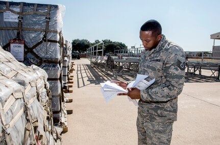 Tech. Sgt. Lloyd Brock, Air Force Medical Operations Agency, matches paperwork to pallets loaded with medical supplies and equipment Aug. 30, 2017 at Joint Base San Antonio-Lackland, Texas.