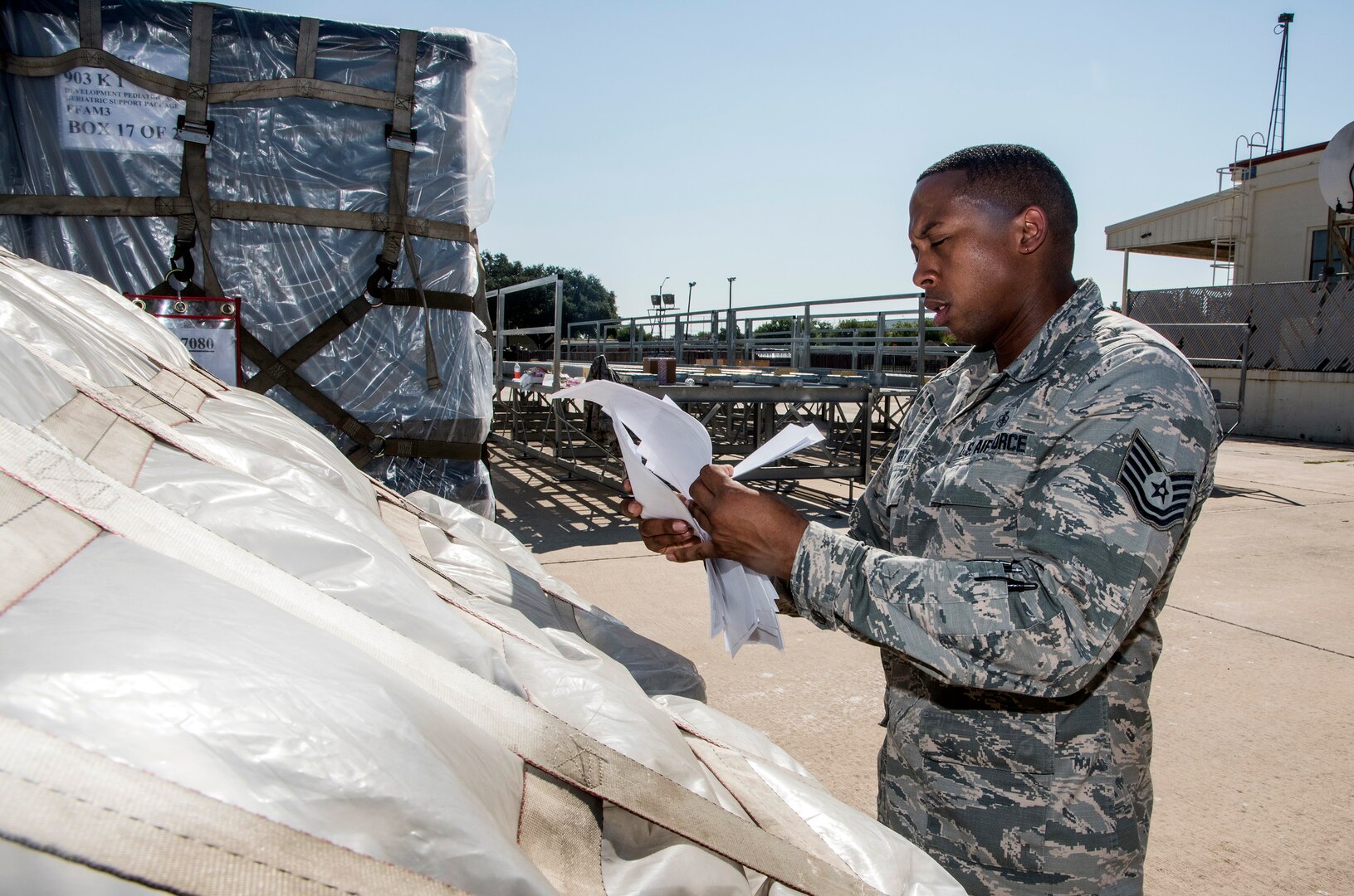 Tech. Sgt. Lloyd Brock, Air Force Medical Operations Agency, matches paperwork to pallets loaded with medical supplies and equipment Aug. 30, 2017, at Joint Base San Antonio-Lackland, Texas.