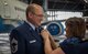 Chief Master Sgt. William Treakle smiles as his wife, Jo Ann Treakle pins on his retirement pin Aug. 5, 2017, Hangar 1, Scott Air Force Base, Illinois. Treakle offically retires after 36 years of total service Sept. 2, 2017. (U.S. Air Force photo by Tech. Sgt. Christopher Parr)