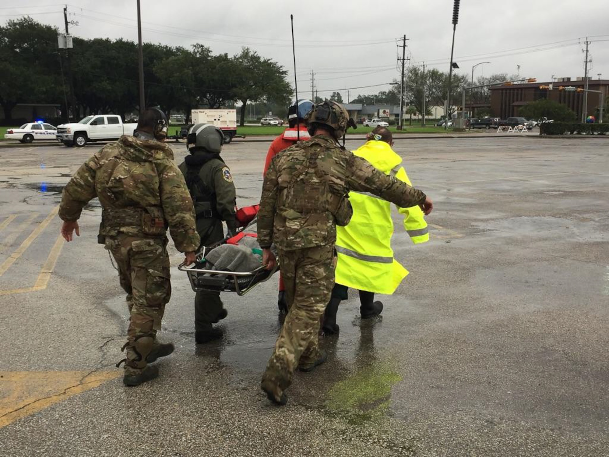 123rd STS Airmen evacuate a casualty of Hurricane Harvey.