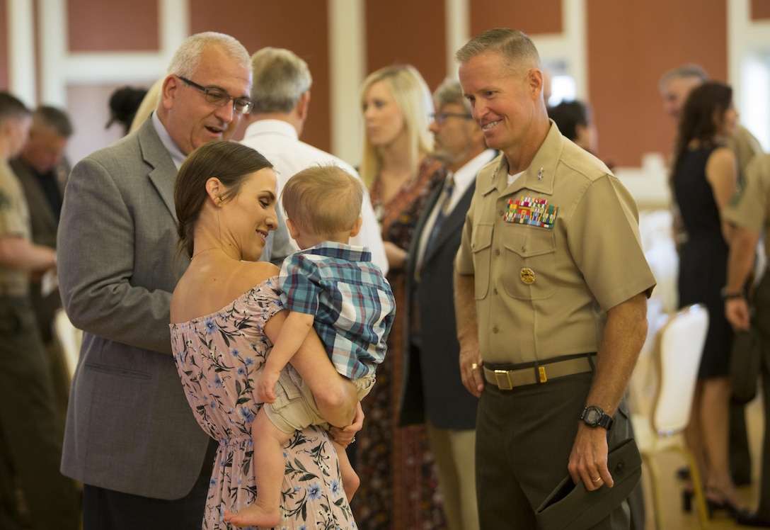 Maj. Gen. Carl E. Mundy III, U.S. Marine Corps Forces, Special Operations Command commander, speaks with the family of one of the seven fallen service members before the celebration of life ceremony aboard Marine Corps Base Camp Lejeune, N.C., Aug. 31, 2017. The ceremony honored the seven MARSOC service members lost in a KC-130T Hercules transport aircraft crash, July 10. The fallen were Staff Sgts. Robert Cox and William Kundrat, Navy special amphibious reconnaissance corpsman, Petty Officer 1st Class Ryan Lohrey , and Sgts. Chad Jenson, Dietrich Schmieman, Joseph Murray and Talon Leach. (U.S. Marine Corps photo by Sgt. Salvador R. Moreno, released)