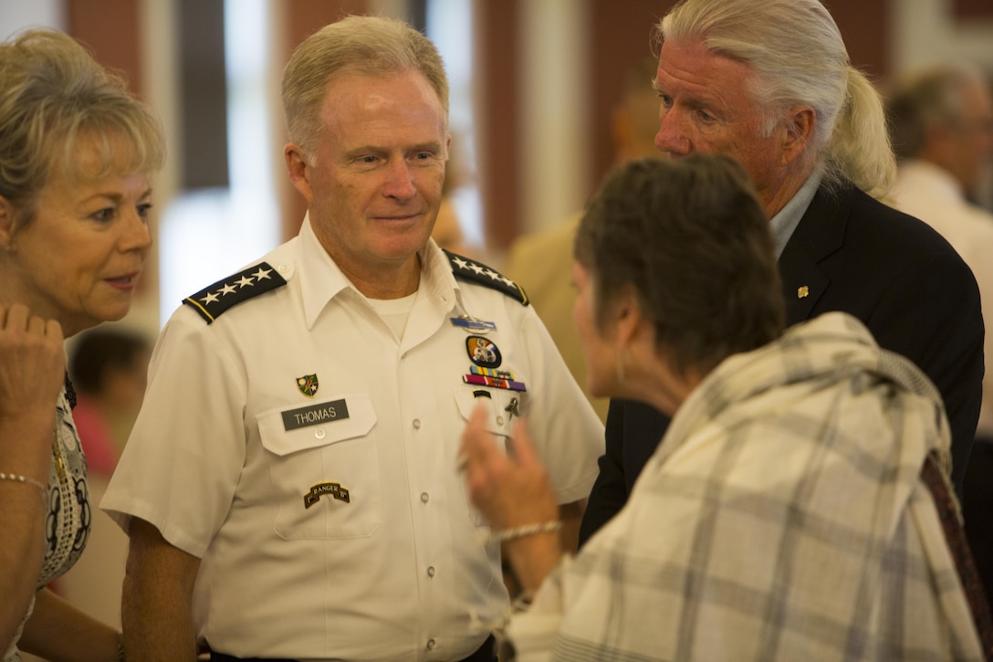 Army Gen. Raymond A. Thomas III, U.S. Special Operations Command commander, speaks with the family of one of the seven fallen service members before the celebration of life ceremony aboard Marine Corps Base Camp Lejeune, N.C., Aug. 31, 2017. The ceremony honored the seven MARSOC service members lost in a KC-130T Hercules transport aircraft crash July 10, which also killed nine Marine reservists. MARSOC’s fallen were Staff Sgts. Robert Cox and William Kundrat, Navy special amphibious reconnaissance corpsman, Petty Officer 1st Class Ryan Lohrey and Sgts. Chad Jenson, Dietrich Schmieman, Joseph Murray, and Talon Leach. (U.S. Marine Corps photo by Sgt. Salvador R. Moreno, released)