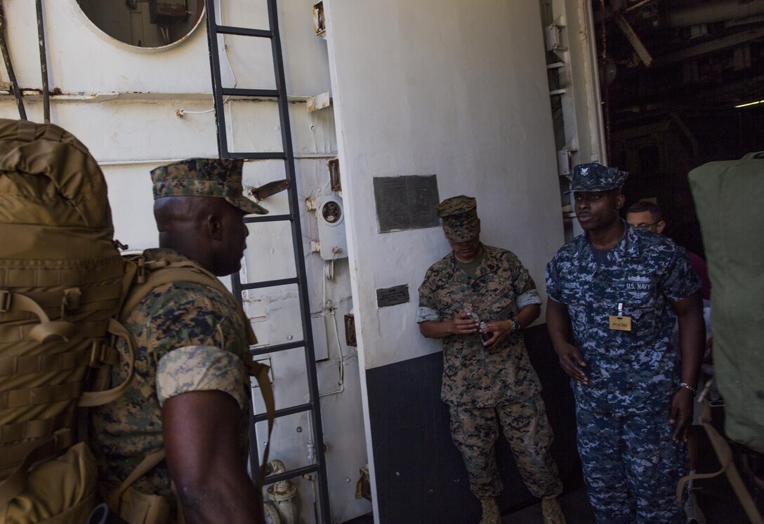 Sgt. Major Jeffrey Young, the sergeant major of the 26th Marine Expeditionary Unit (MEU), II Marine Expeditionary Force, boards the USS Kearsarge (LHD 3) at Naval Station Norfolk, Va., Aug 30, 2017.