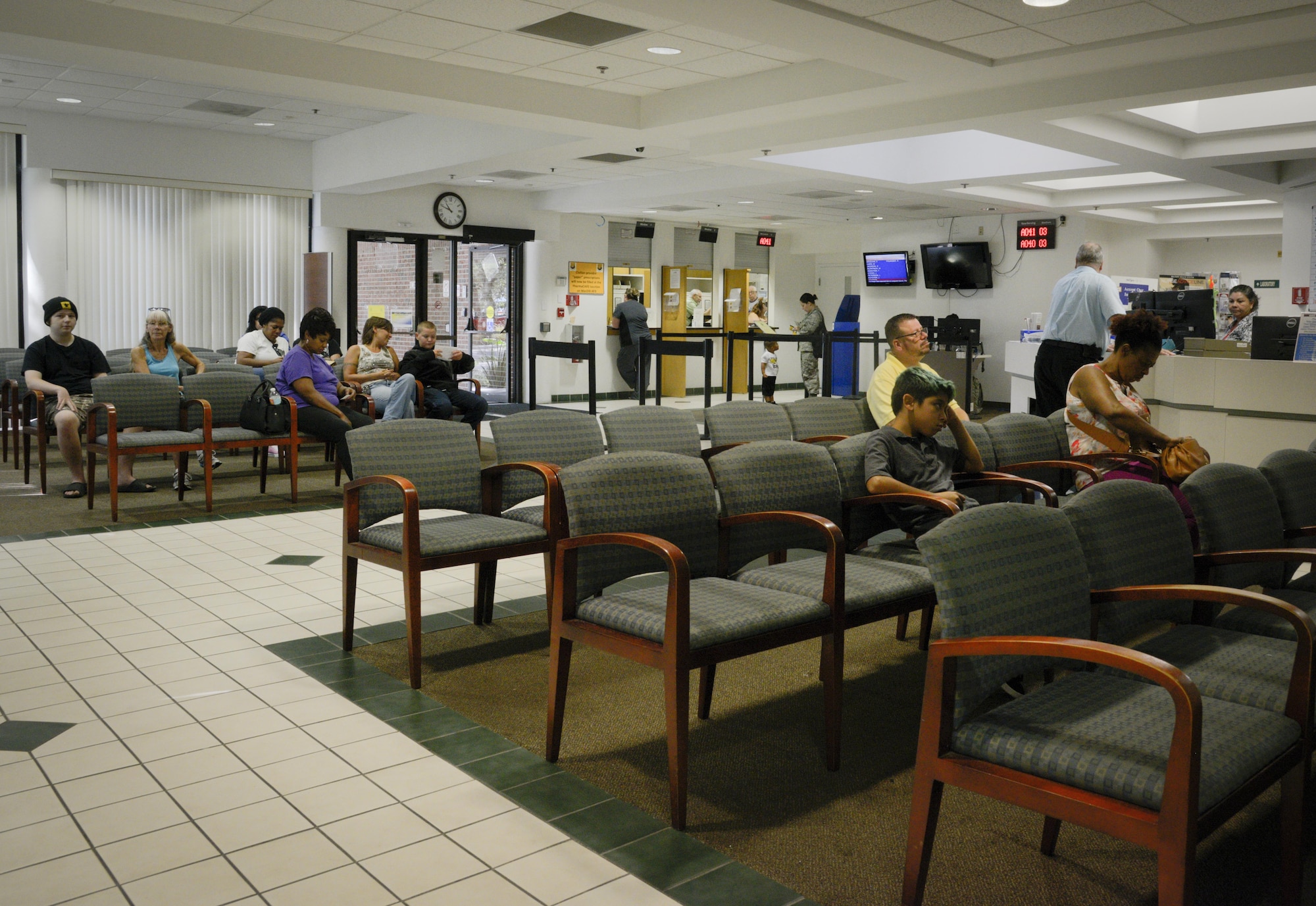 Patients wait in the clinic lobby area and pick up medication at the pharmacy window at the Brandon Clinic, Aug. 30, 2017. The Brandon Clinic is one of only nine geographically-separated medical units in the Air Force. (U.S. Air Force photo by Senior Airman Mariette Adams)