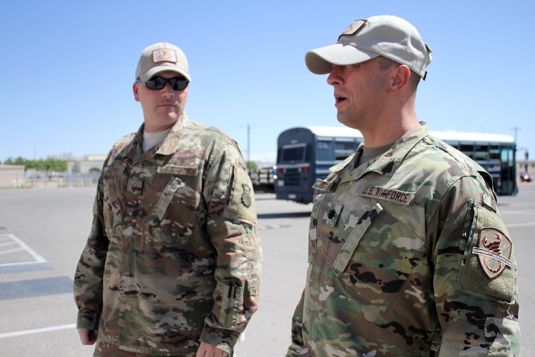 From left, Master Sgt. Bryan Godfrey and Lt. Col. Bernard Sprute, commander of the Air Force Security Forces Center's Desert Defender Ground Combat Readiness Training Center, talk about possible uses for the center's training space.