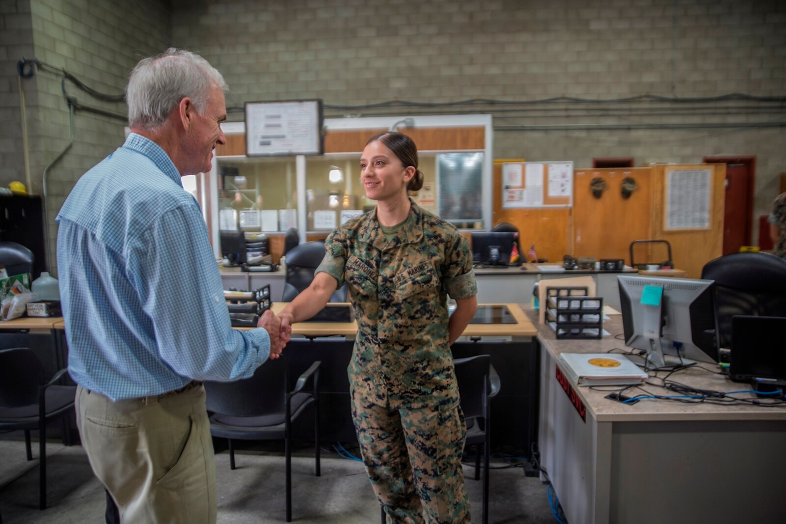 Richard Spencer, the Secretary of the Navy, greets Lance Cpl. Tatiana Marquez, a warehouse clerk with 1st Maintenance Battalion, Combat Logistics Regiment 15, 1st Marine Logistics Group, on Camp Pendleton, Calif., August 30, 2017. Spencer toured 1st Maintenance Battalion and talked to Marines about their capabilities and accomplishments. (U.S. Marine Corps photo by Lance Cpl. Adam Dublinske)