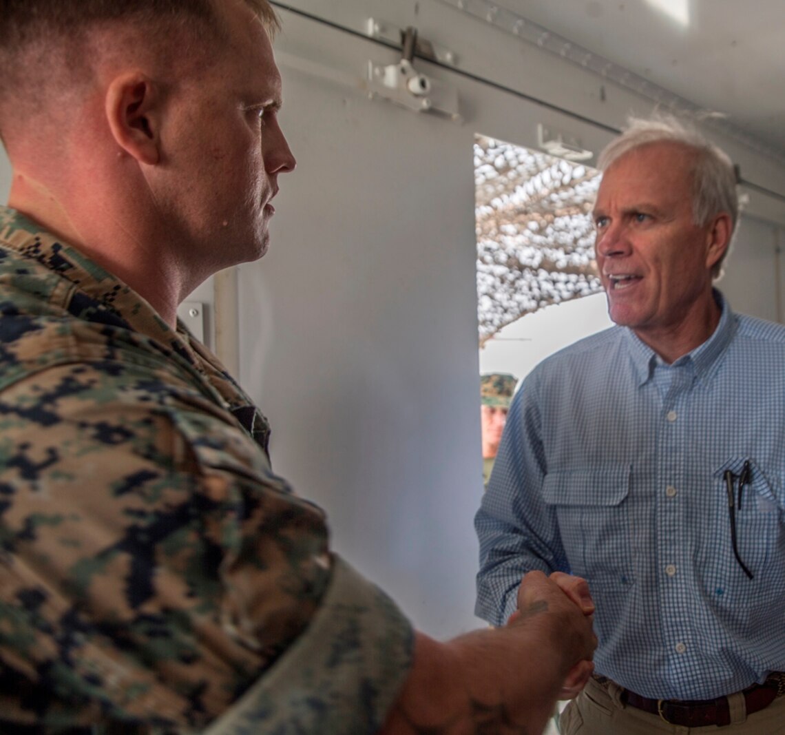 U.S. Marine Staff Sgt. Wesley Jones, an optics technician with 1st Maintenance Battalion, Combat Logistics Regiment 15, 1st Marine Logistics Group, meets with Richard Spencer, the Secretary of the Navy, on Camp Pendleton, Calif., August 30, 2017. Spencer toured 1st Maintenance Battalion and talked to Marines about their capabilities and accomplishments. (U.S. Marine Corps photo by Lance Cpl. Adam Dublinske)