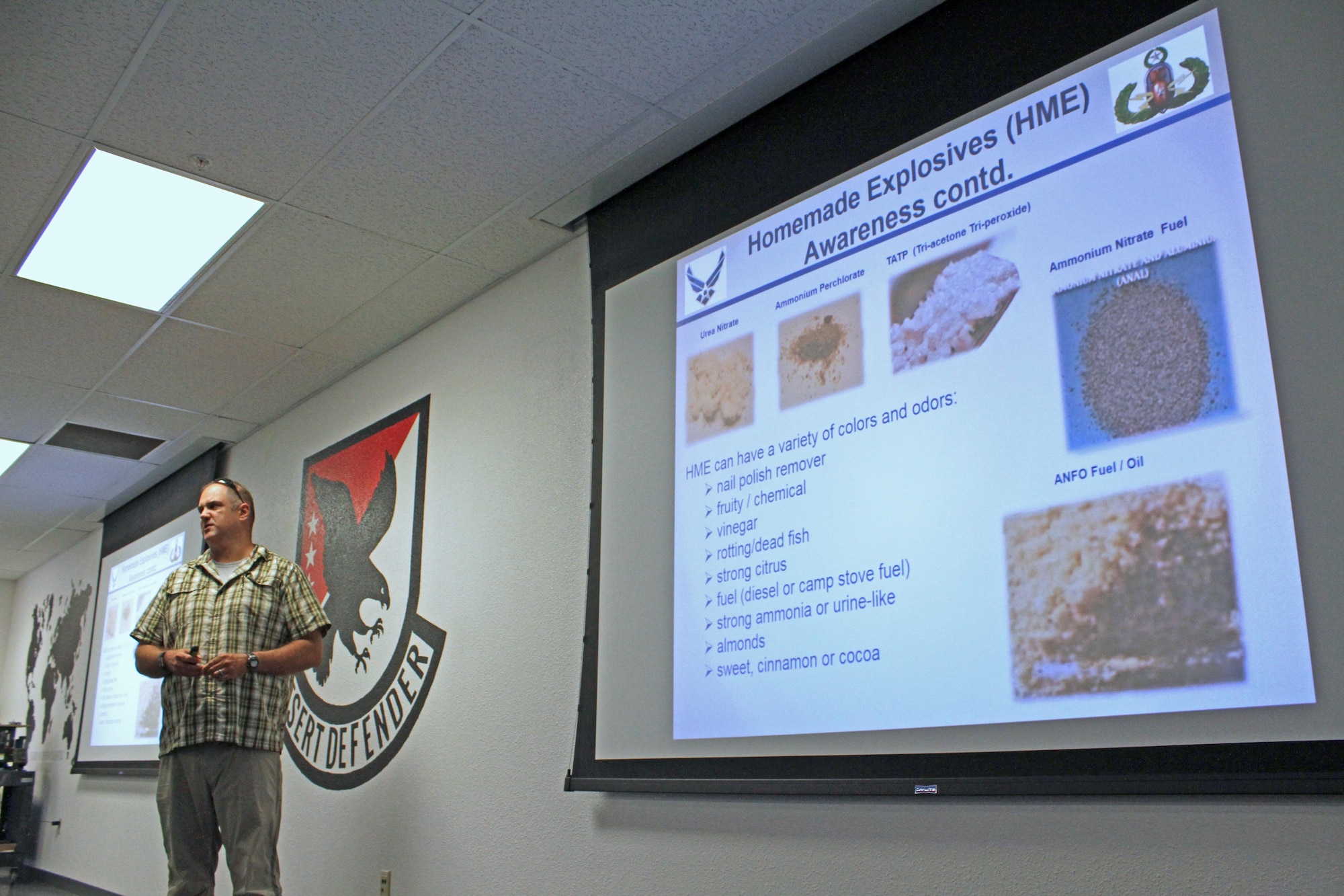 Mike Labarge, senior counter improvised explosive device integrator at the Air Force Security Forces Center's Desert Defender Ground Combat Readiness Training Center, talks to students about the types of IEDs they may encounter as well as how to detect them.