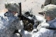 Assistant gunner Airman 1st Class Johnathan Gomez feeds ammunition for Airman 1st Class Cameren Miller during heavy weapons firing on Fort Bliss' Range 39 July 26, 2017.