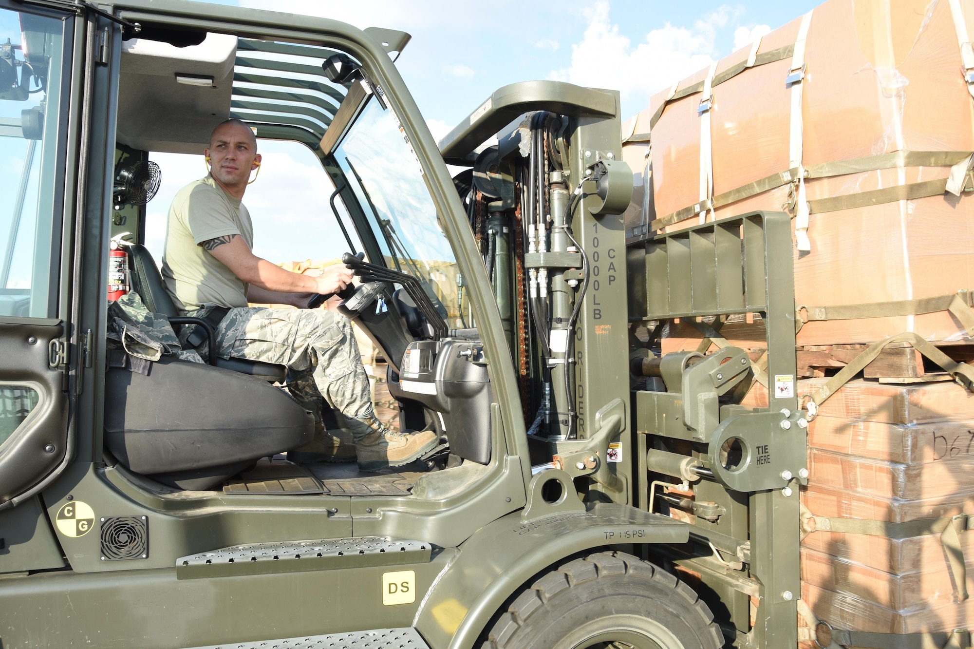 Air Force Senior Master Sgt. Landon Bonds, 73rd Aerial Port Squadron operations superintendent, navigates a forklift to load a portion of the 90,000 lbs. of American Red Cross supplies August 29, 2017, at Naval Air Station Fort Worth Joint Reserve Base, Texas, in support of Hurricane Harvey relief efforts. Supplies included blankets and cots and were transported as part of the Defense Support of Civil Authority. Department of Defense provides medium and heavy lift rotary wing assets, along with ground transportation, to move personnel, commodities and equipment within Texas. (U.S. Air Force photo by Ms. Julie Briden-Garcia)