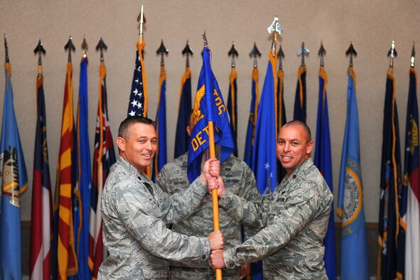 U.S. Air Force Lt. Col. Erik Haynes, the 66th Training Squadron (TRS) commander, passes a guidon to Maj. Daniel Franz, the Detachment 1, 66th TRS commander, Aug. 31, 2017, at Eielson Air Force Base, Alaska. As commander Franz will oversee the Arctic Survival School operations. (U.S. Air Force photo by Airman 1st Class Eric M. Fisher)