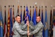 U.S. Air Force Lt. Col. Erik Haynes, the 66th Training Squadron (TRS) commander, passes a guidon to Maj. Daniel Franz, the Detachment 1, 66th TRS commander, Aug. 31, 2017, at Eielson Air Force Base, Alaska. As commander Franz will oversee the Arctic Survival School operations. (U.S. Air Force photo by Airman 1st Class Eric M. Fisher)