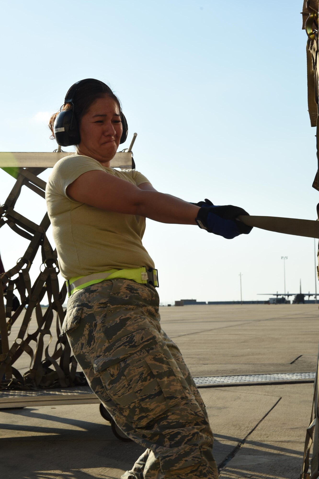 Air Force Master Sgt. Viviana Molina, 73rd Aerial Port Squadron air transportation, secures webbing straps on 90,000 lbs. of American Red Cross supplies August 29, 2017, at Naval Air Station Fort Worth Joint Reserve Base, Texas, in support of Hurricane Harvey relief efforts. Supplies included blankets and cots and were transported as part of the Defense Support of Civil Authority. Department of Defense provides medium and heavy lift rotary wing assets, along with ground transportation, to move personnel, commodities and equipment within Texas. (U.S. Air Force photo by Ms. Julie Briden-Garcia)