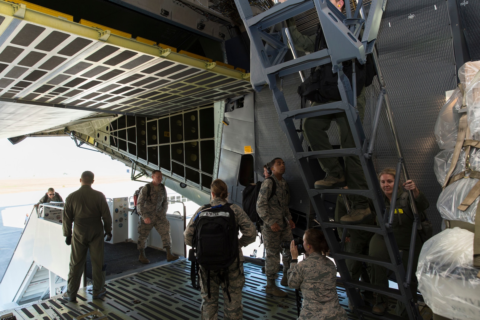 U.S. Air Force medical personnel board a military aircraft