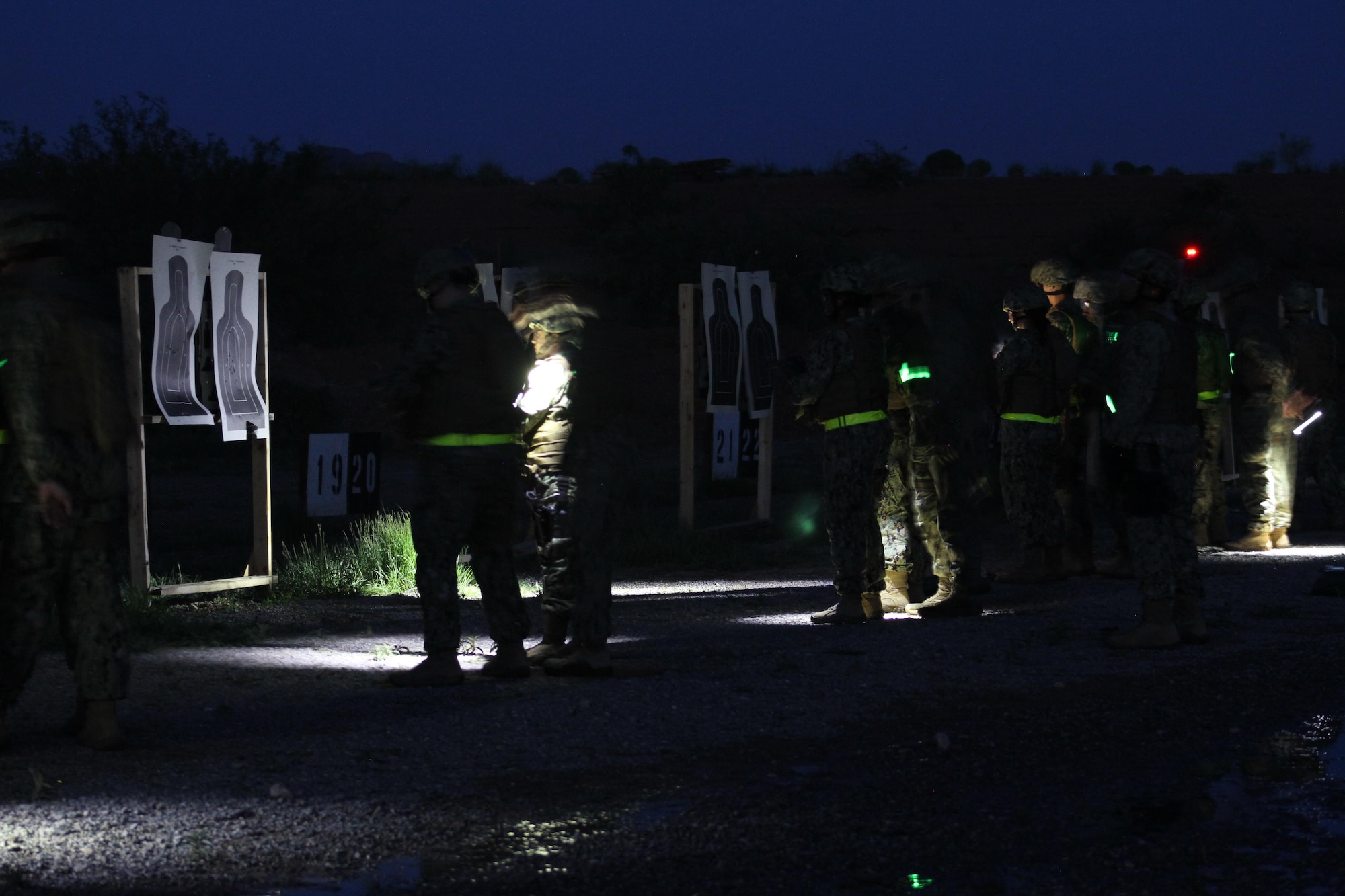 U.S. Navy students at Desert Defender, the Air Force Security Forces Center’s Ground Combat Readiness Training Center at Fort Bliss, Texas, conduct night fire training.
