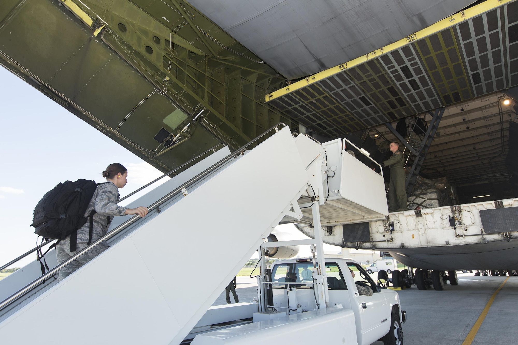 U.S. Air Force medical personnel board a military aircraft