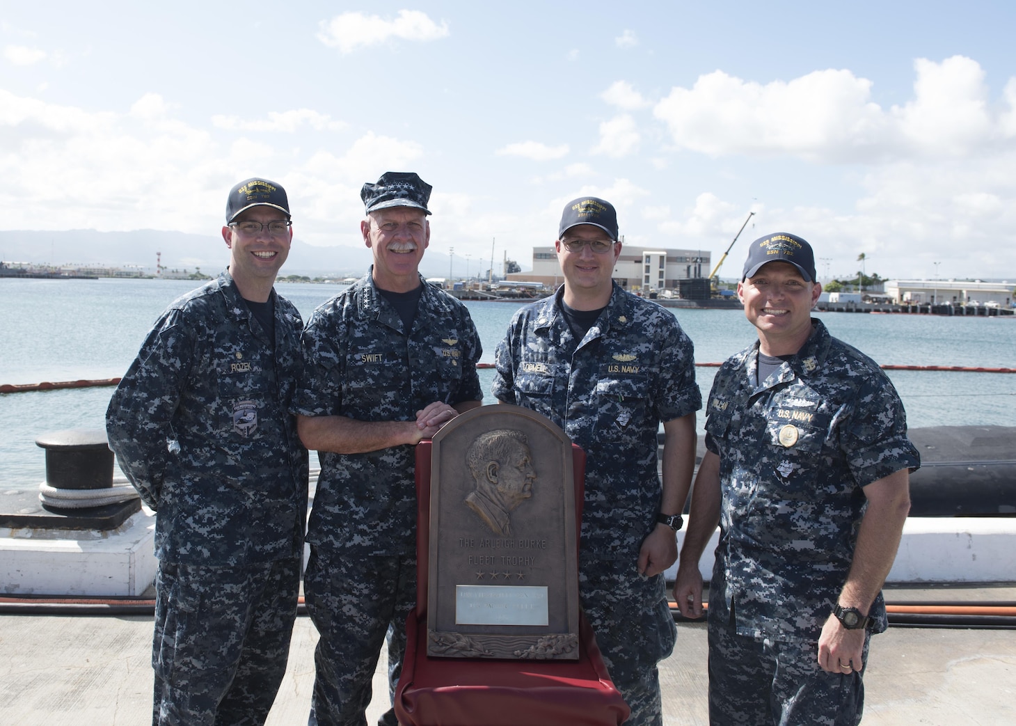 170830-N-KV911-104 PEARL HARBOR, Hawaii (Aug. 30, 2017) Adm. Scott Swift, commander, U.S. Pacific Fleet presents the Arleigh Burke Fleet Trophy to the crew of the Virginia-class fast-attack submarine USS Mississippi (SSN 782). The trophy is awarded to a ship that best represents the fleet, achieving the best overall improvement in battle efficiency, and is presented annually to the most-improved ships or aviation squadrons in both the Atlantic and Pacific Fleets. (U.S. Navy photo by Mass Communication Specialist 2nd Class Shaun Griffin)