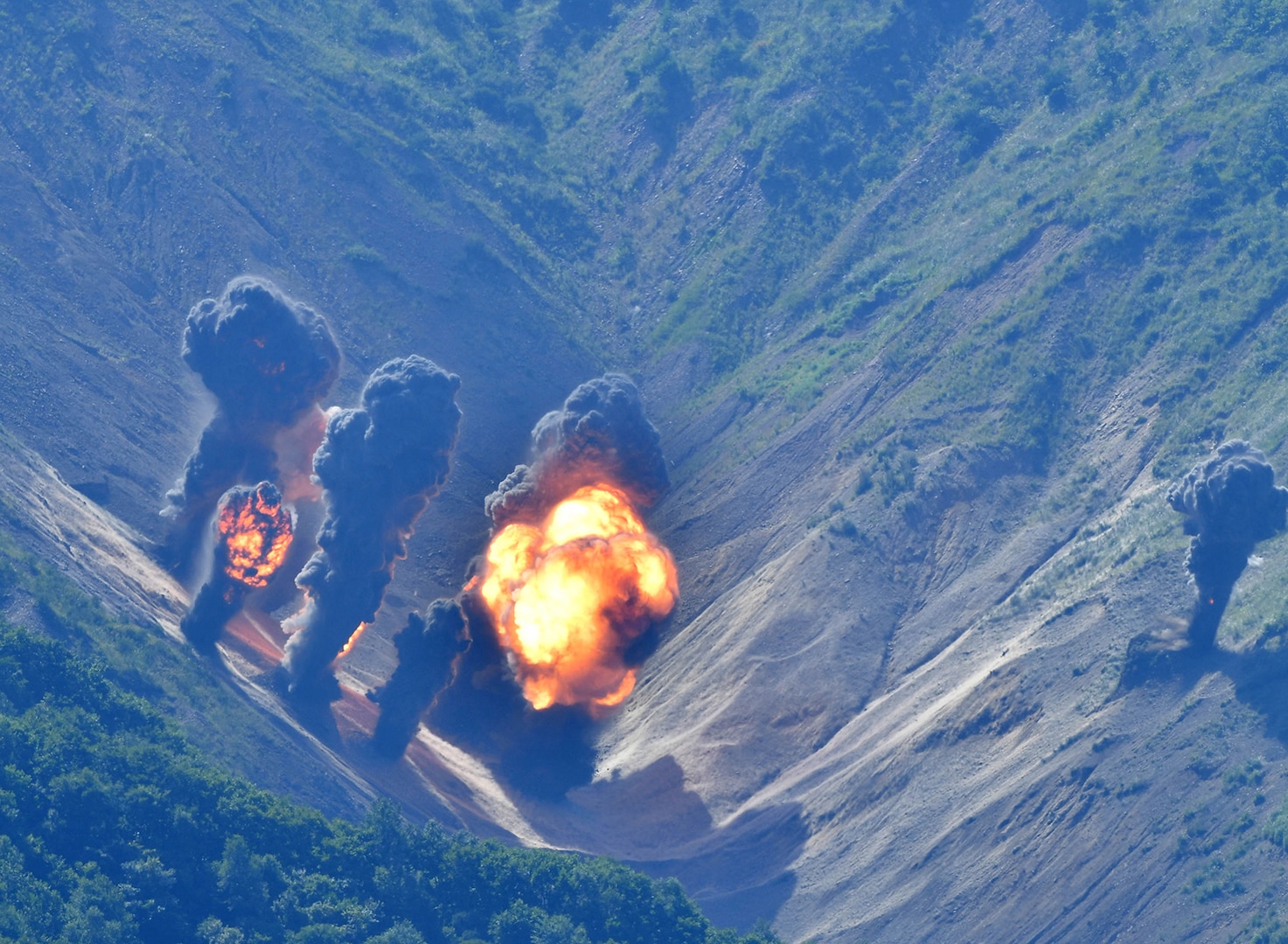 Weapons dropped from F-35Bs and B-1Bs strike the Pilsung Range in South Korea during a live-fire training mission