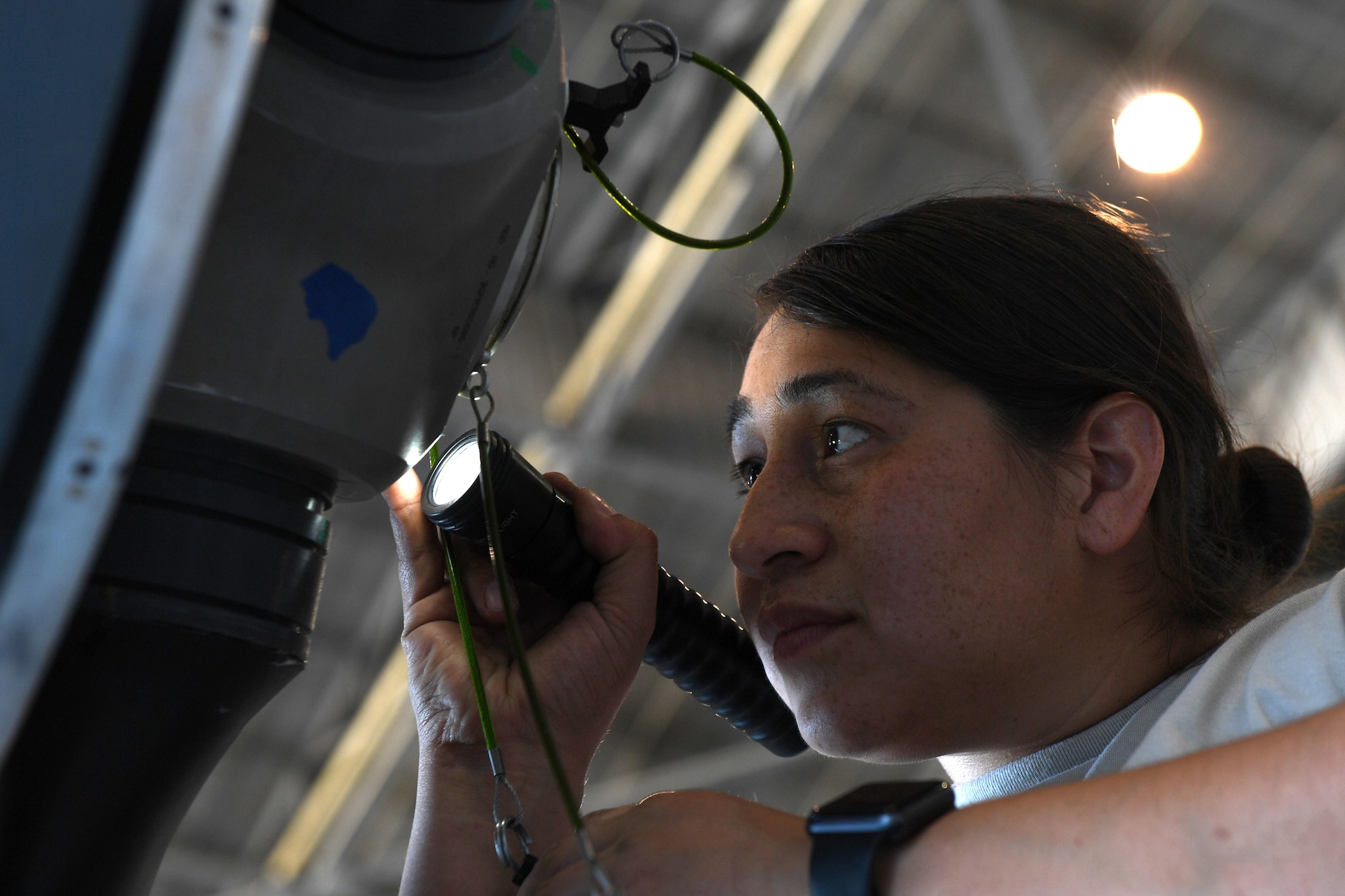 Staff Sgt. Nickie, MQ-9 Reaper crew chief assigned to the 432nd Maintenance Group, installs a locking pin to the motor during the assembly of the MQ-9 model Aug. 24, 2017, at Dover Air Force Base, Del.