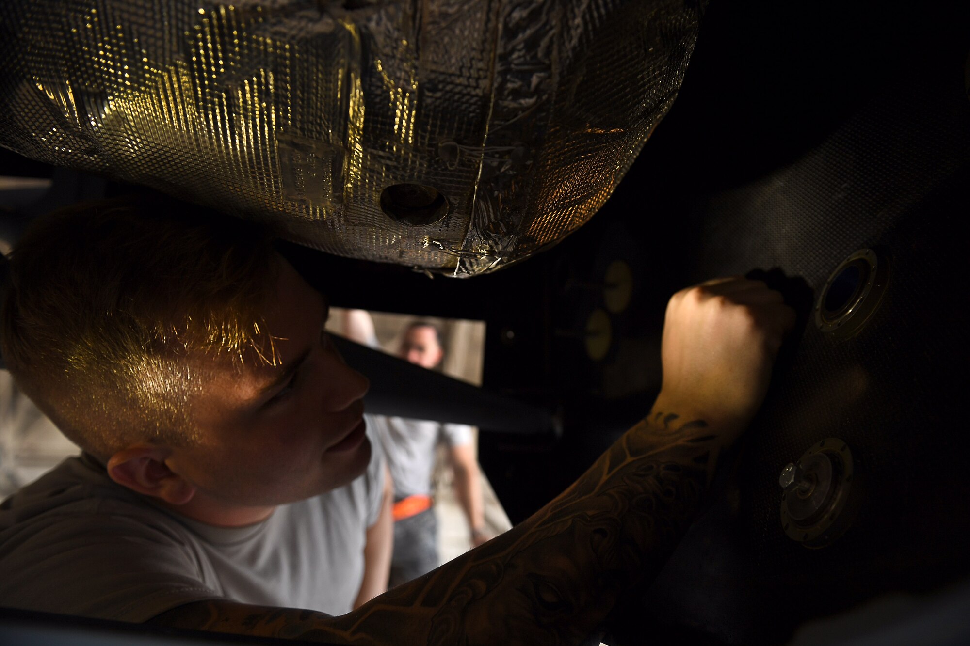 Airman 1st Class Conner, crew chief assigned to the 432nd Maintenance Group, inspects the inside of an MQ-9 Reaper model fuselage August 24, 2017, at Dover Air Force Base, Del.