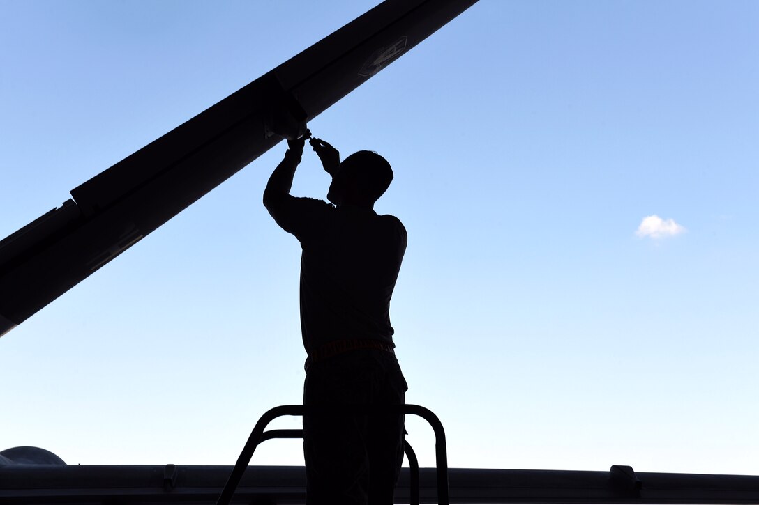 An Airman assigned to the 432nd Maintenance Group, performs maintenance on the MQ-9 Reaper model in preparation for the 2017 Thunder Over Dover Open House Aug. 24, 2017, at Dover Air Force Base, Del.