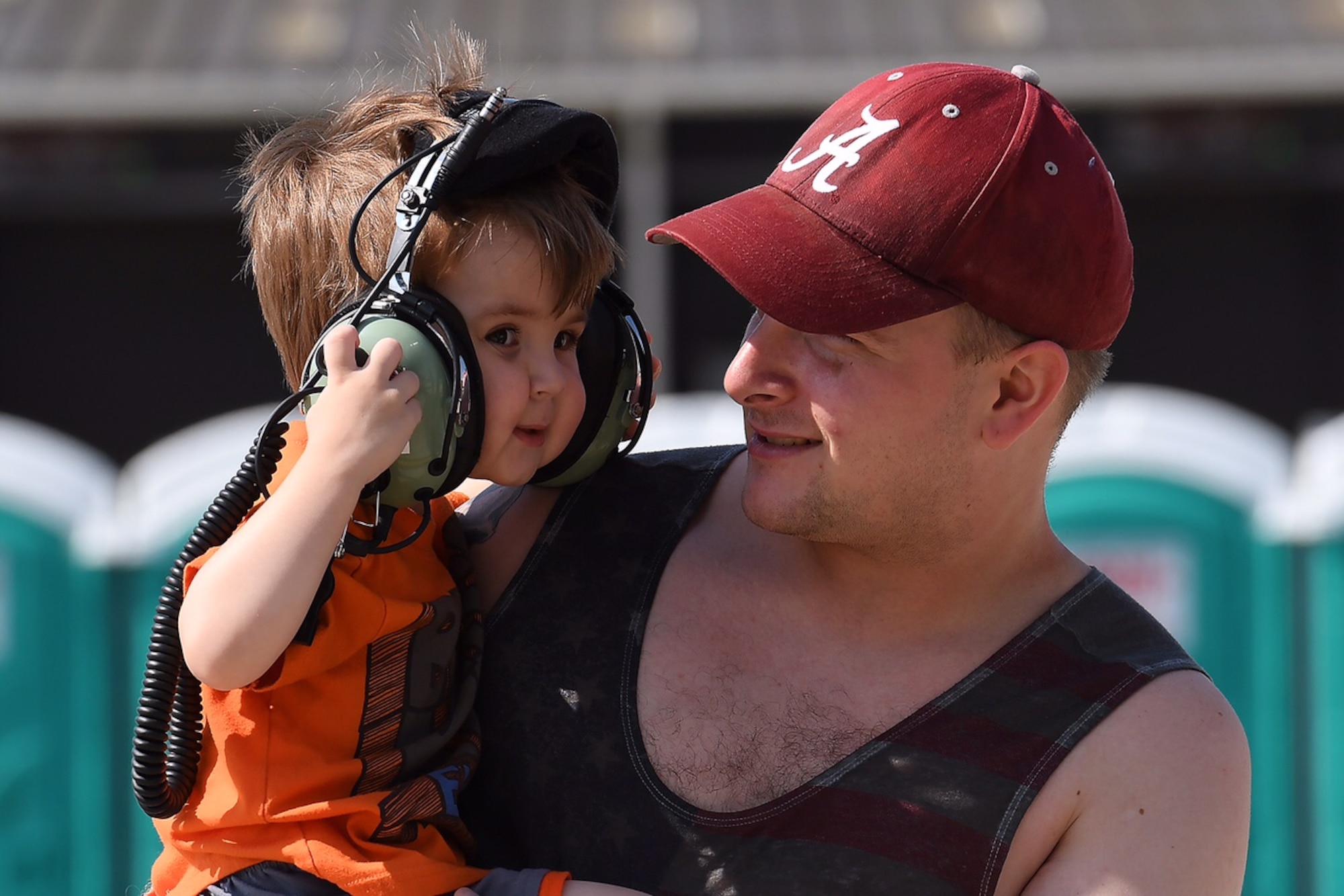 A father lifts his son for a better view at the Thunder Over Dover Open House at Dover Air Force Base, Del. Airmen from the 432nd Wing traveled from Las Vegas to help educate that public on remotely piloted aircraft operations and missions.