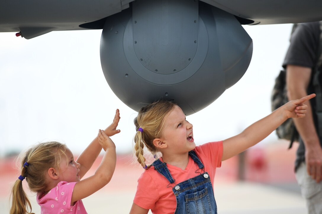 Children touch the Multi-Spectral Targeting System of an MQ-9 Reaper at the Thunder Over Dover Open House, Aug. 25, 2017, at Dover Air Force Base, Del.