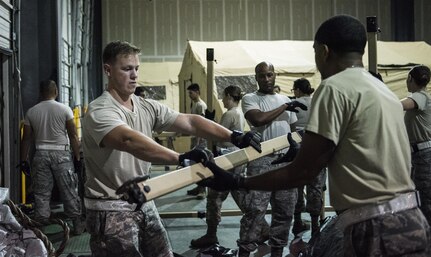 Personnel from the 59th Medical Wing, Joint Base San Antonio-Lackland, Texas, prepare their equipment to accept patients at the George Bush Intercontinental Airport in Houston, Texas, in response to the devastation caused by Hurricane Harvey, August 30, 2017. The 59th MDW is part of a larger Department of Defense presence in an effort to aid eastern Texas following a record amount of rainfall and flooding. (U.S. Air Force photo/Senior Airman Stefan Alvarez)