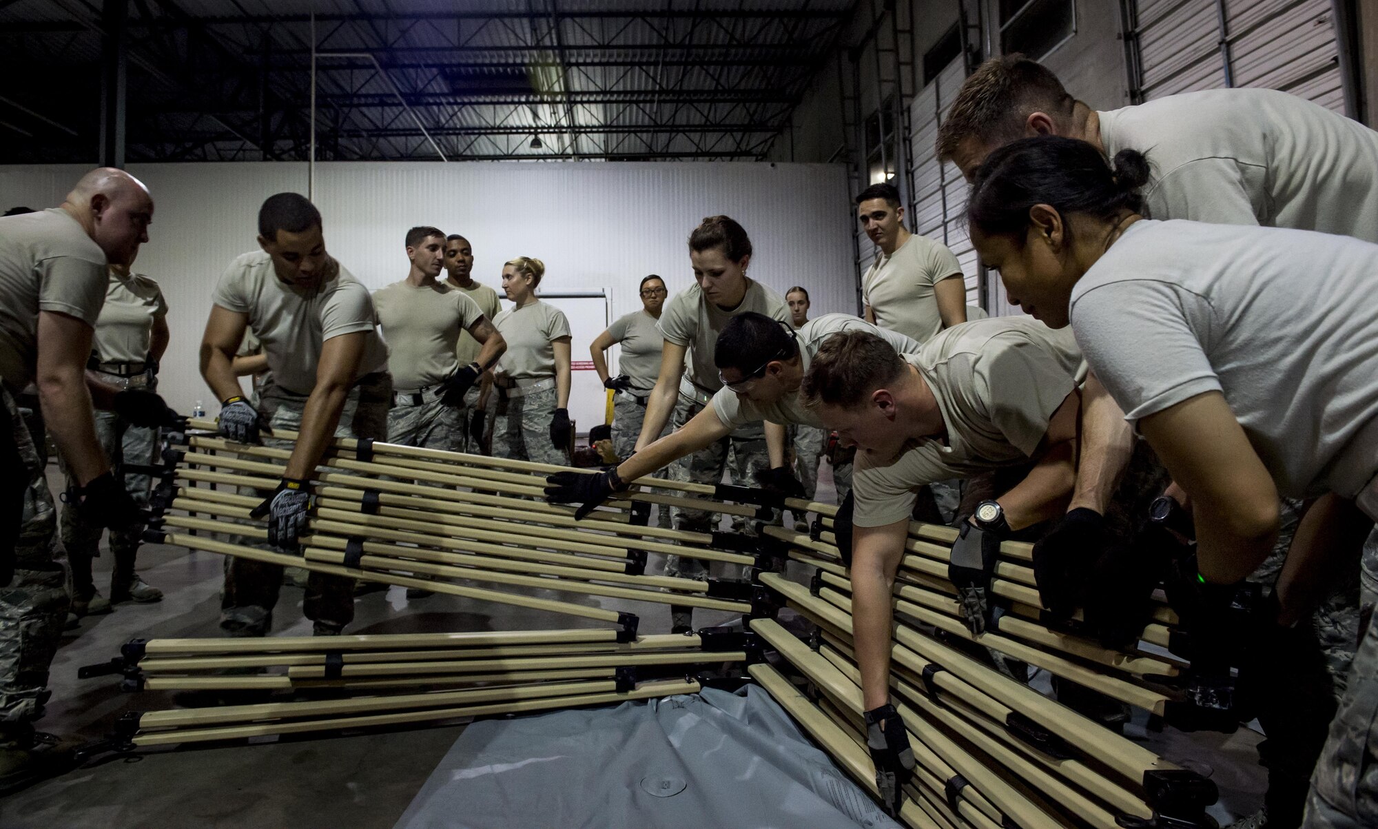 Personnel from the 59th Medical Wing, Joint Base San Antonio-Lackland, Texas, set up a medical tent inside a hangar at the George Bush Intercontinental Airport in Houston, Texas, during relief efforts following the devastation caused by Hurricane Harvey, August 30, 2017. The 59th MDW is part of a larger Department of Defense presence in an effort to aid eastern Texas following a record amount of rainfall and flooding. (U.S. Air Force photo/Senior Airman Keifer Bowes)